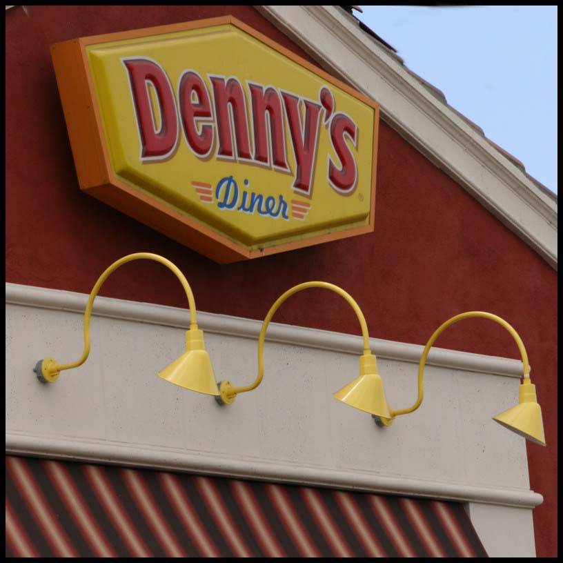 Mount angle shaded gooseneck lighting above awnings and below signage.